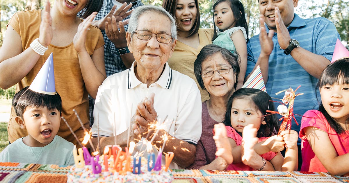 Grandfather having a birthday party with family