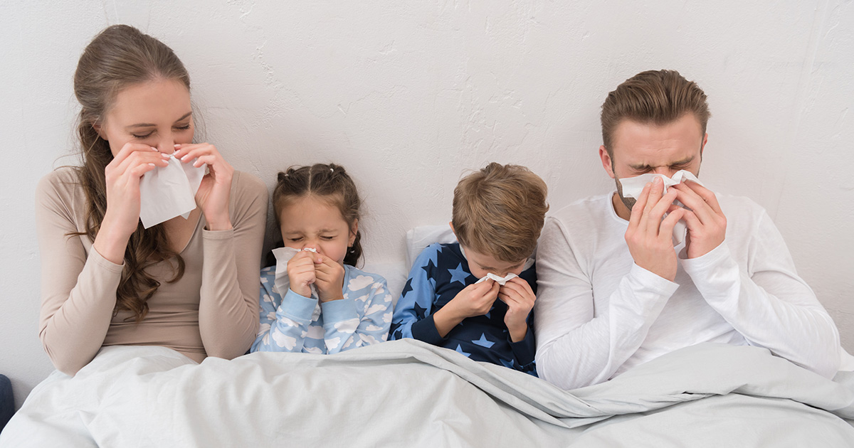 A family in bed with the flu