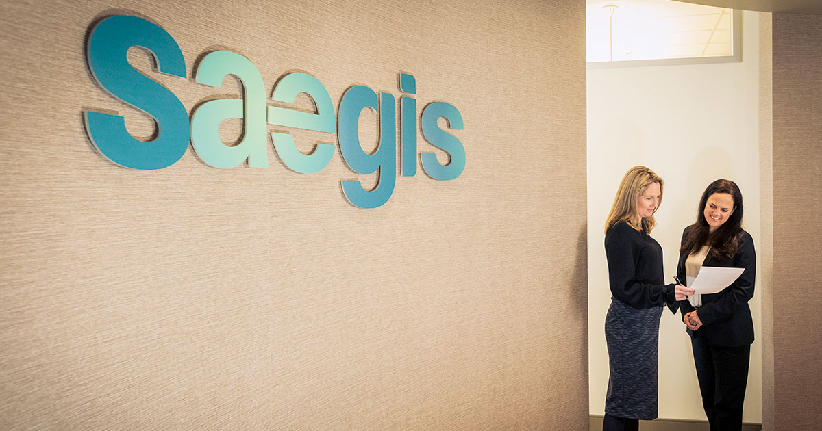 Two women speaking in a Saegis office