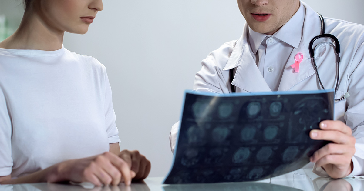 Doctor explaining mammogram to patient