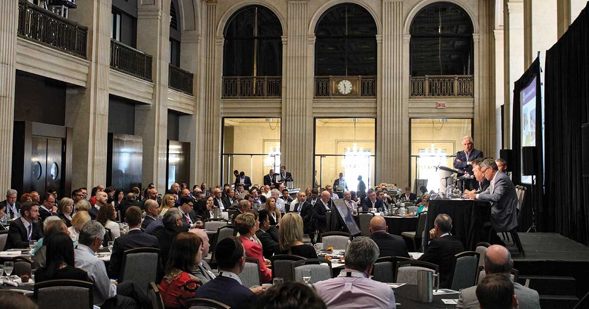 People speaking at a conference