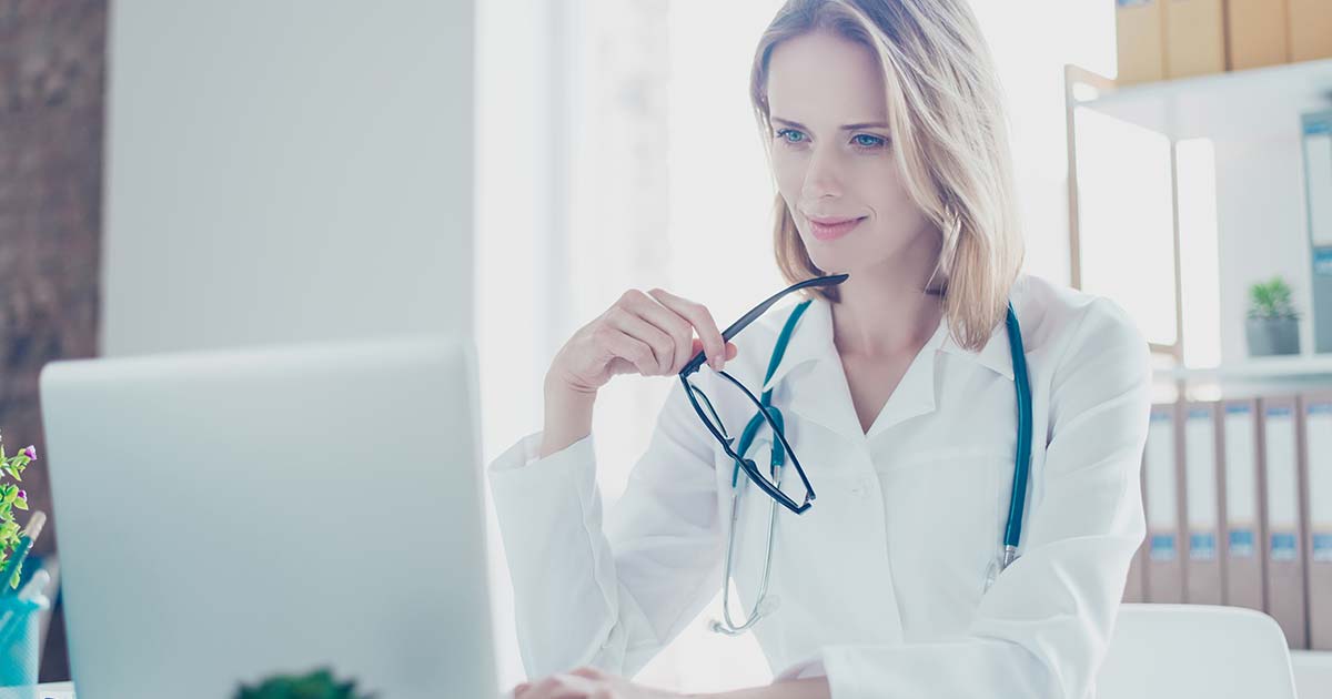 Female doctor working on a computer