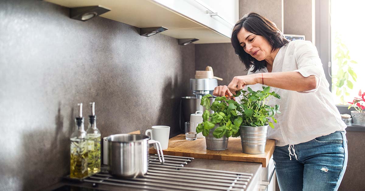 Woman tending to houseplants