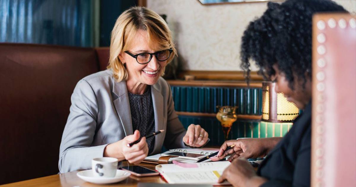 Two women having a meeting in a diner
