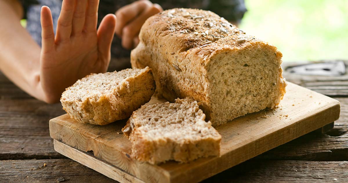 A person refusing a piece of bread
