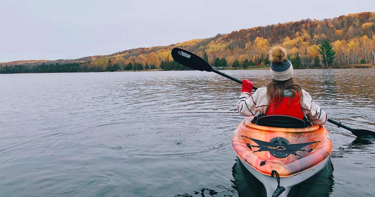 Woman kayaking on a lake