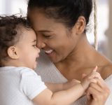 mother baby child smiling