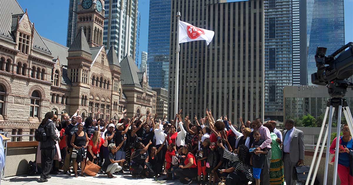 sickle cell people pointing flag