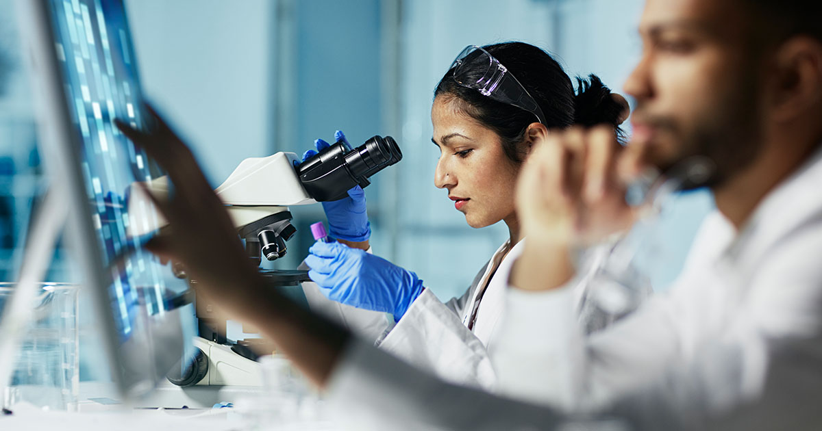 researchers lab microscope