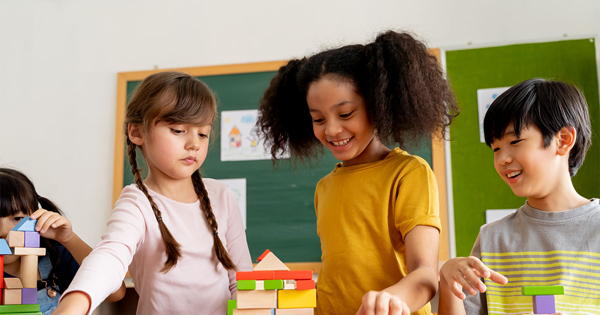 young children of mixed race playing in school