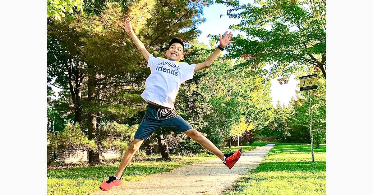 young asian man jumping in air