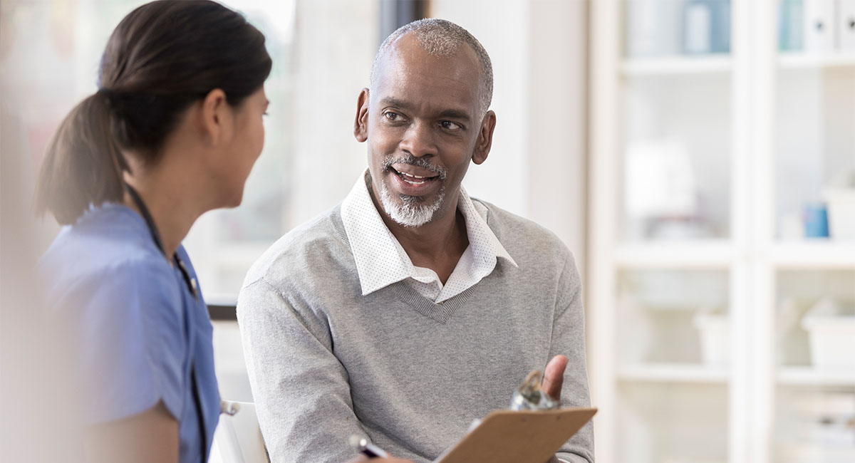 Man Speaking to a Doctor