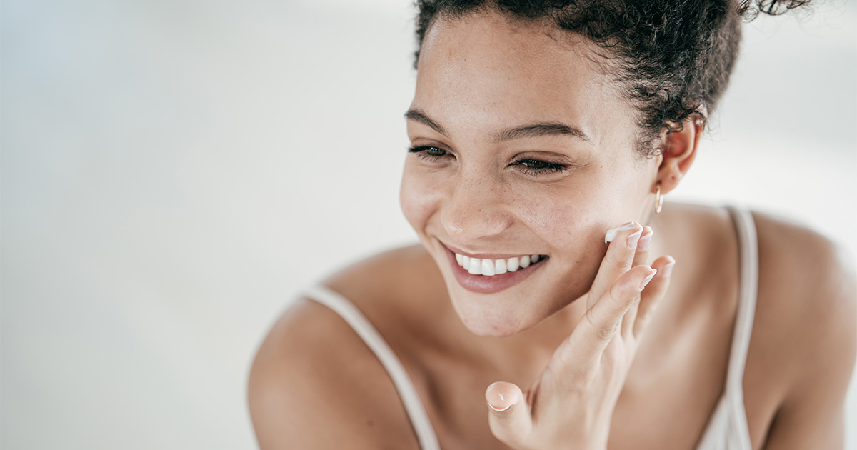 woman applying cream face
