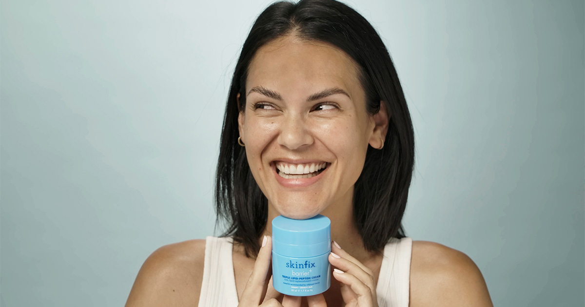 woman smiling with skinfix cream