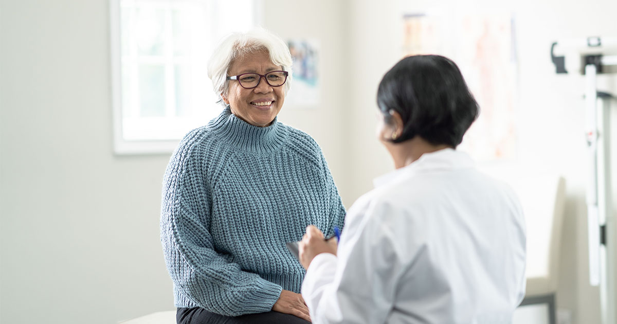 senior woman consulting with doctor