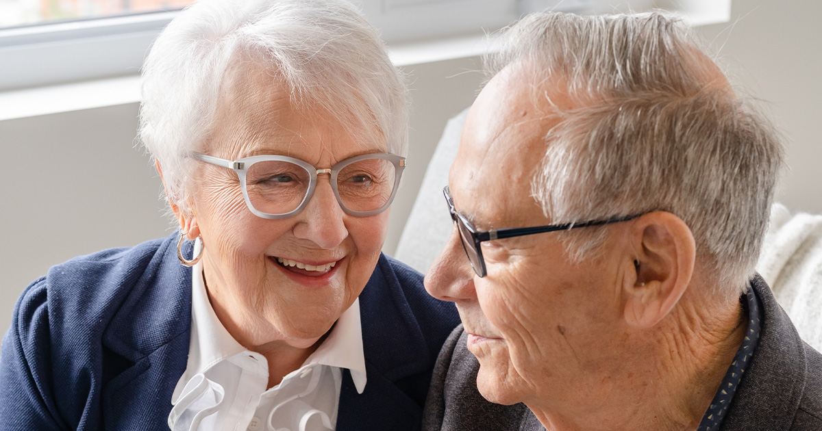 elderly couple smiling together