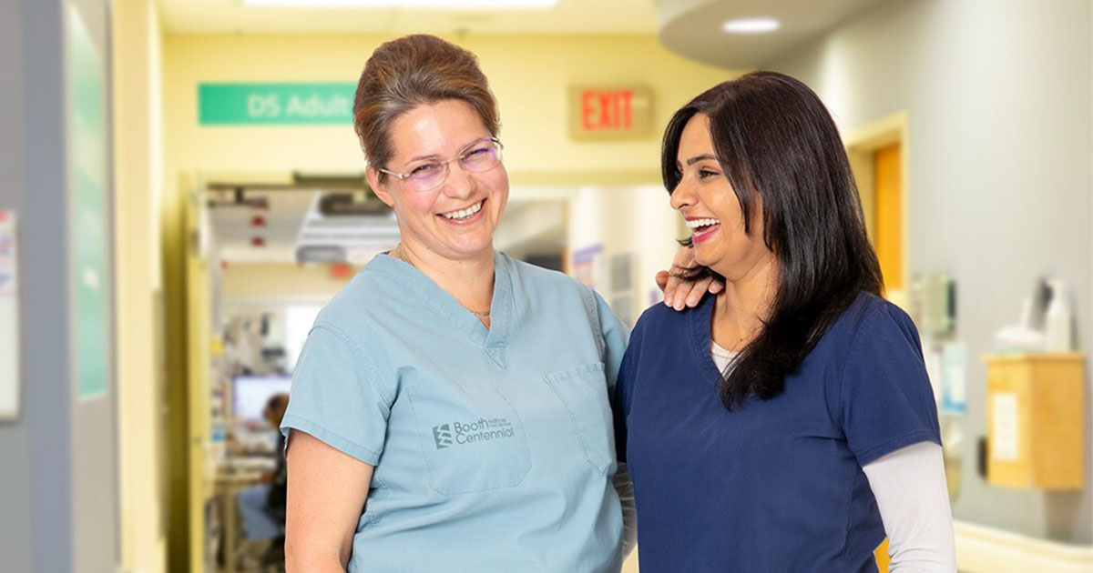 two nurses standing beside eachother