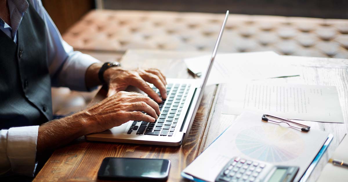 elderly man typing