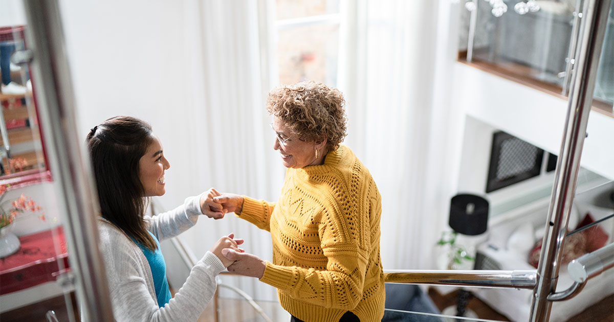senior woman being assisted by medical professional
