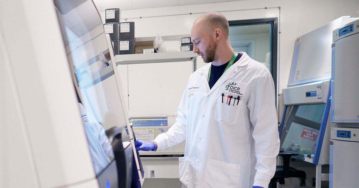 scientist in medical coat oicr