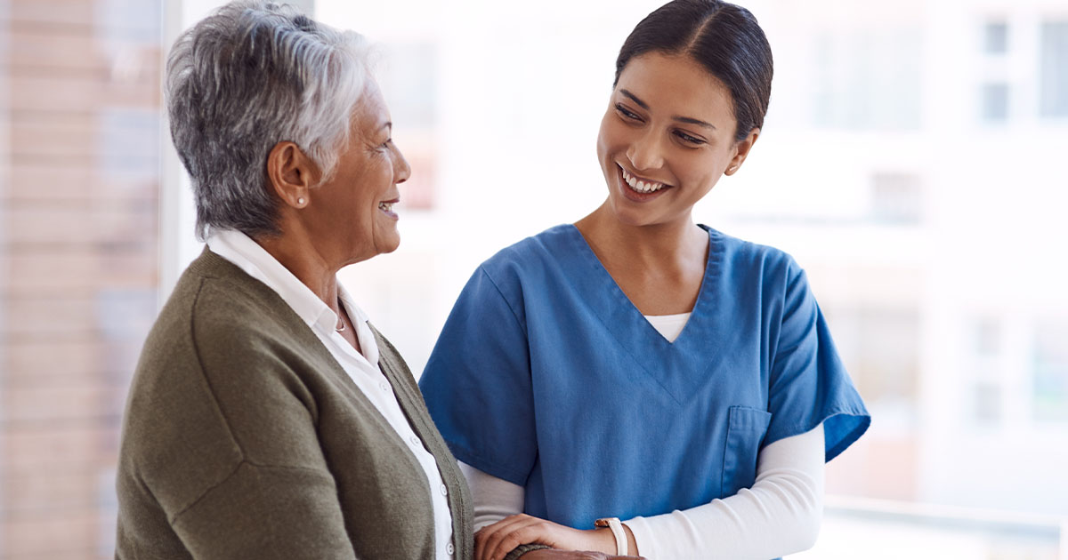 Nurse attending to old lady