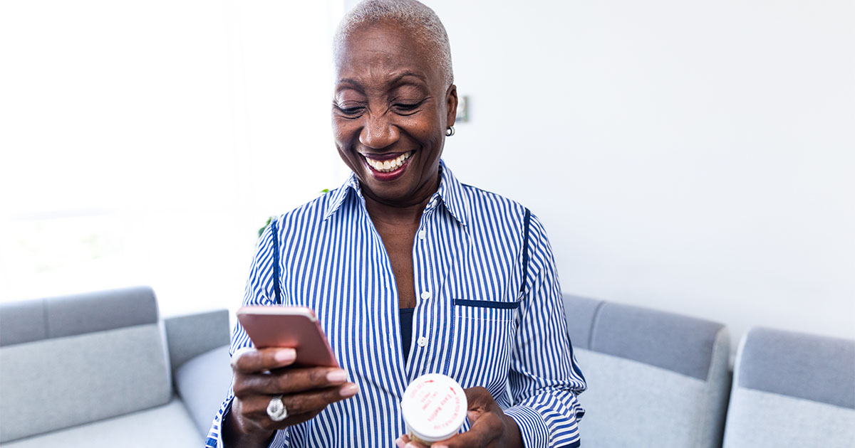 Woman smiling at her phone