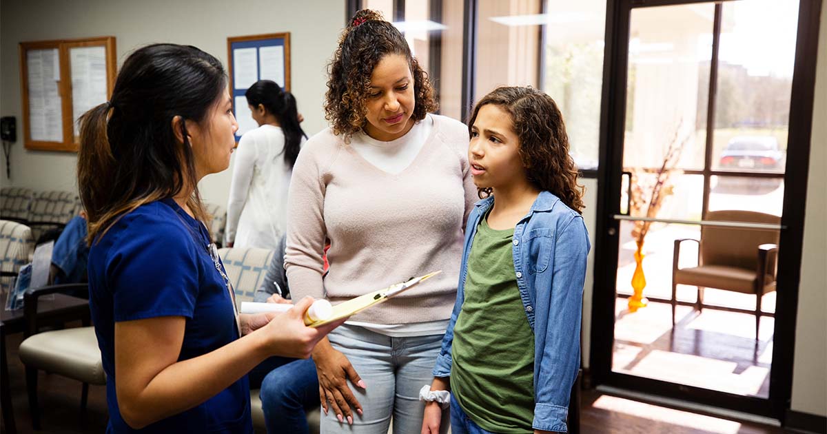young girl with mother at hospital