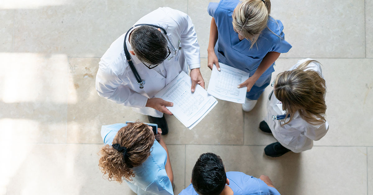doctors glancing over notes