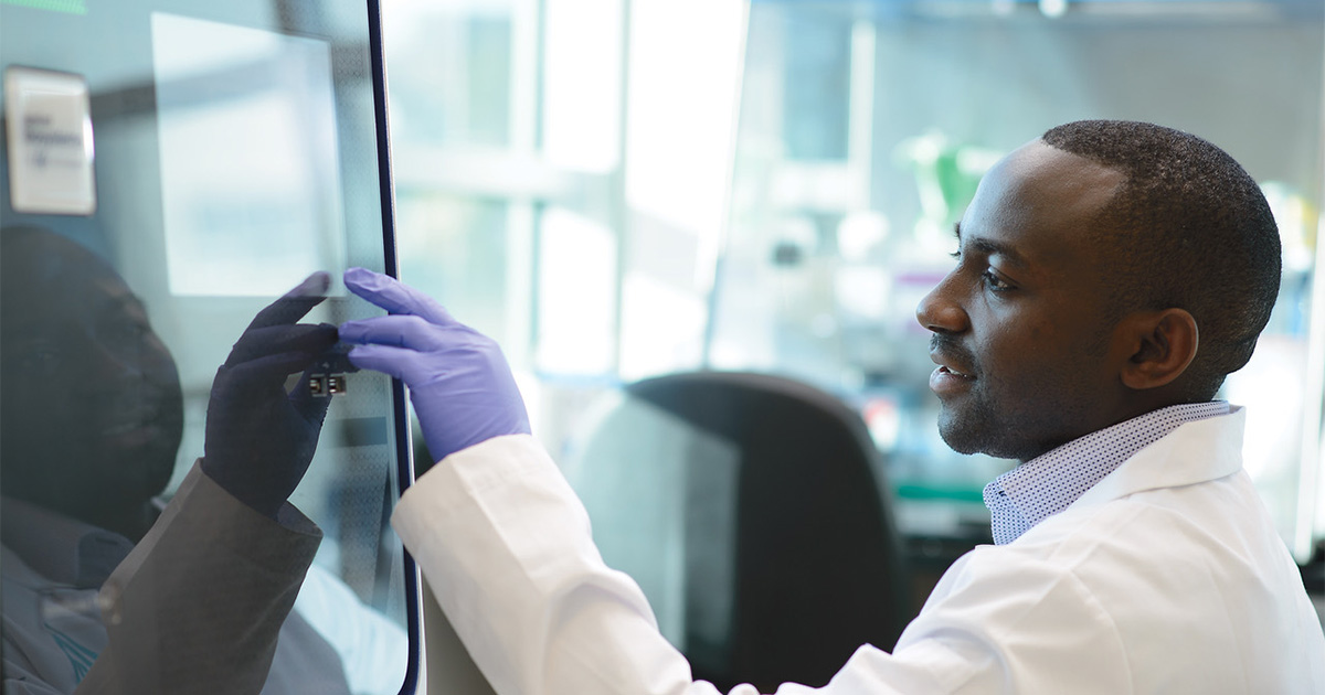 black medical professional checking records