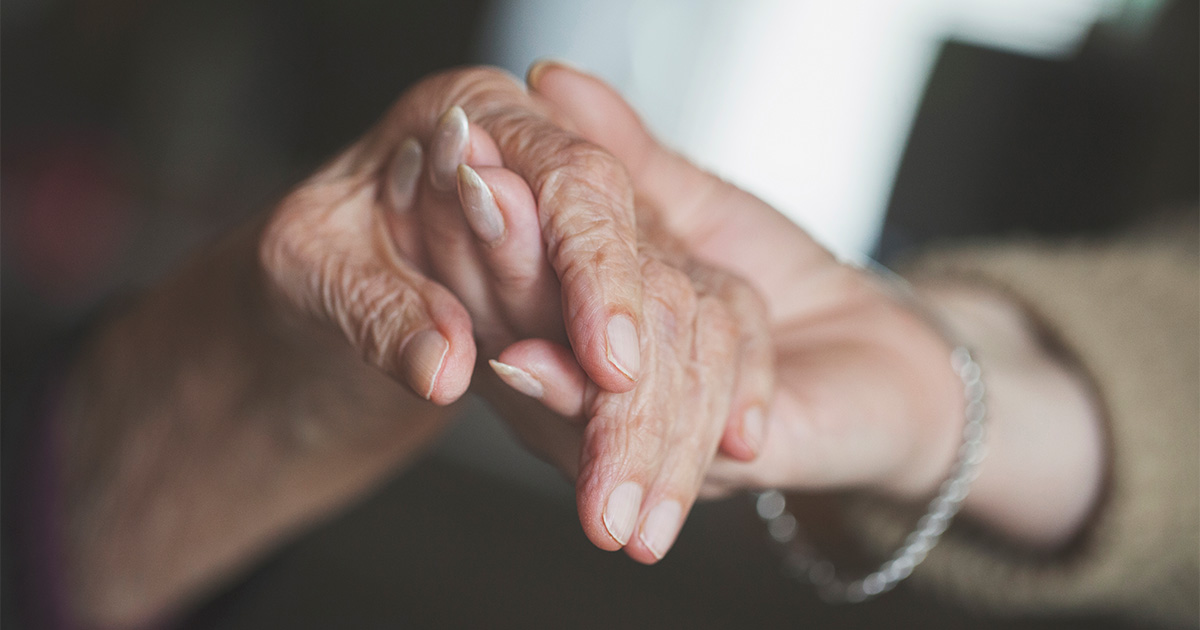 seniors holding hands