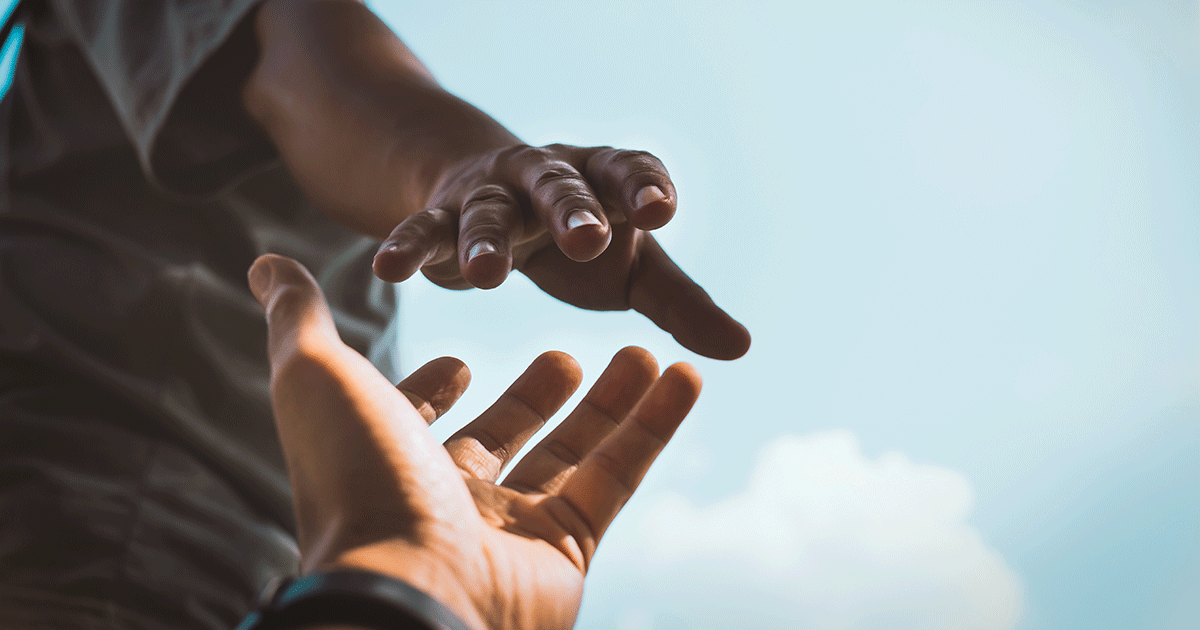 hands reaching out for mental wellness support