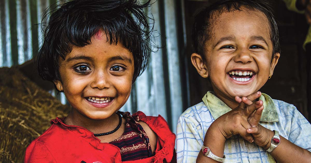 Two smiling young girls in South Asia