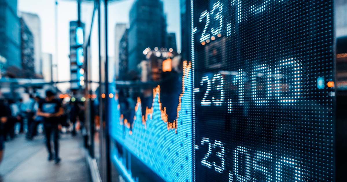 Stock market ticker on a busy street