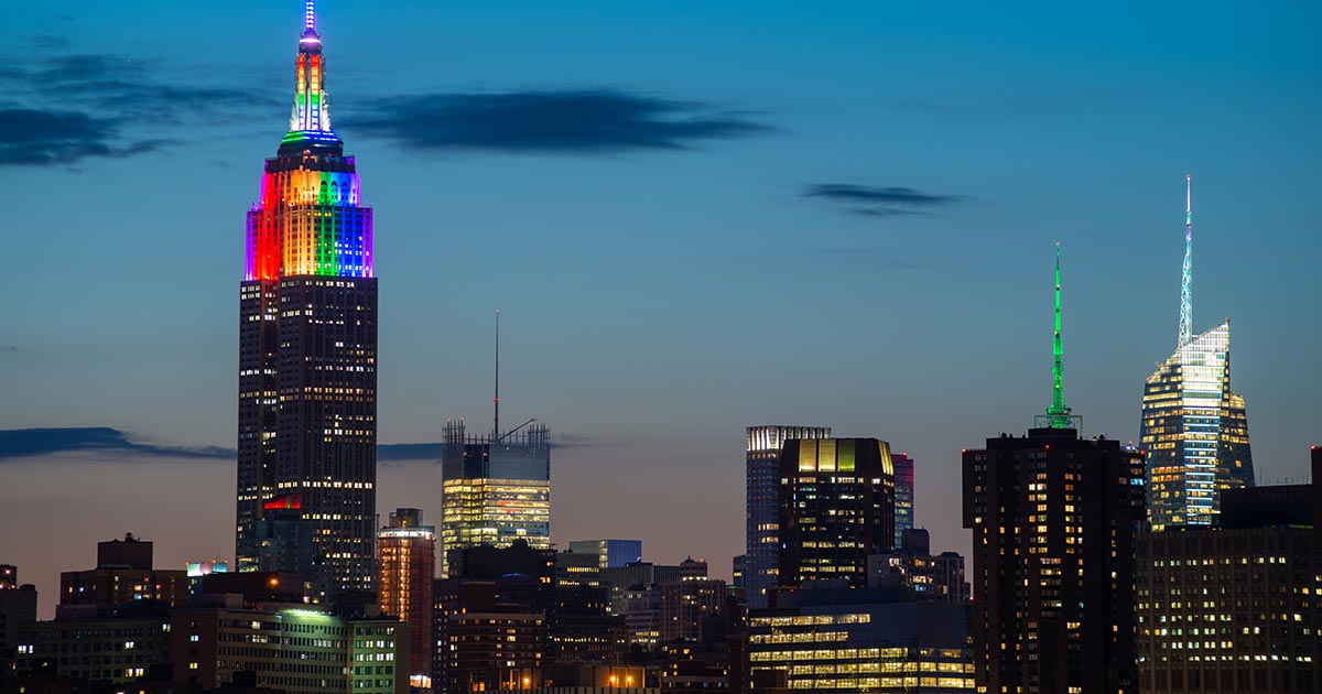The Empire State Building lit up with a Pride rainbow