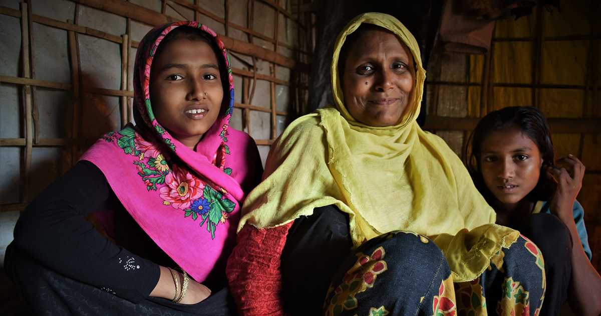 Rohingya refugee Ayesha with her daughters in her shelter in the camps in Cox's Bazar, Bangladesh.