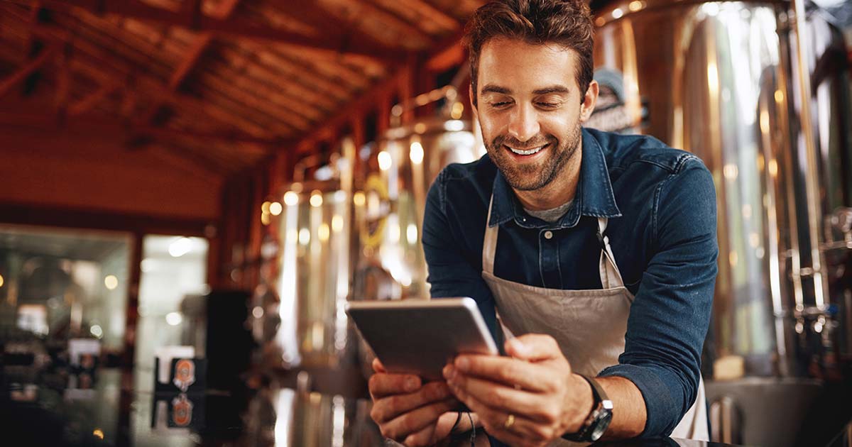 Brewery worker on a tablet