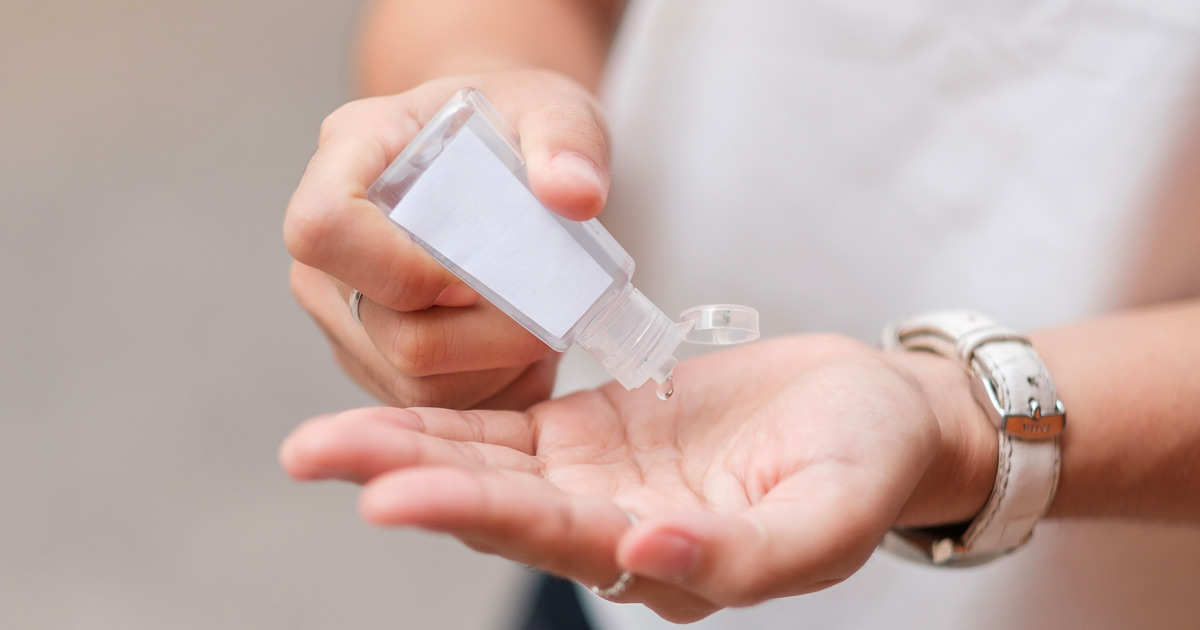 Person using hand sanitizer