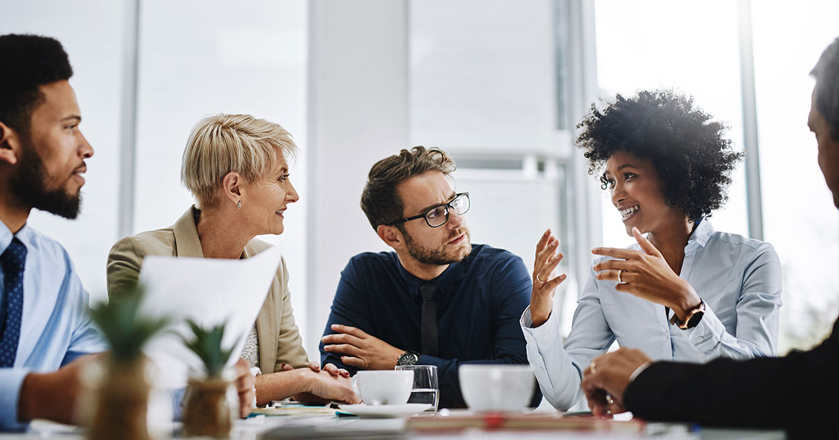 Woman speaking animatedly in a meeting