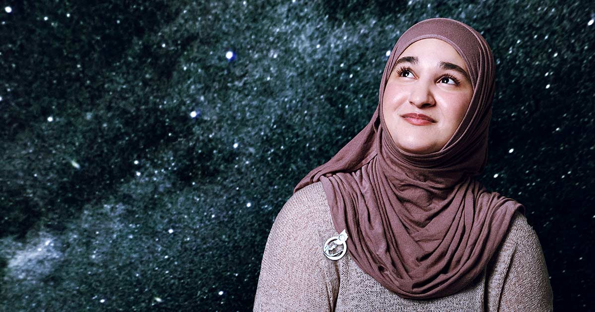 Zainab Azim looking up into the night sky