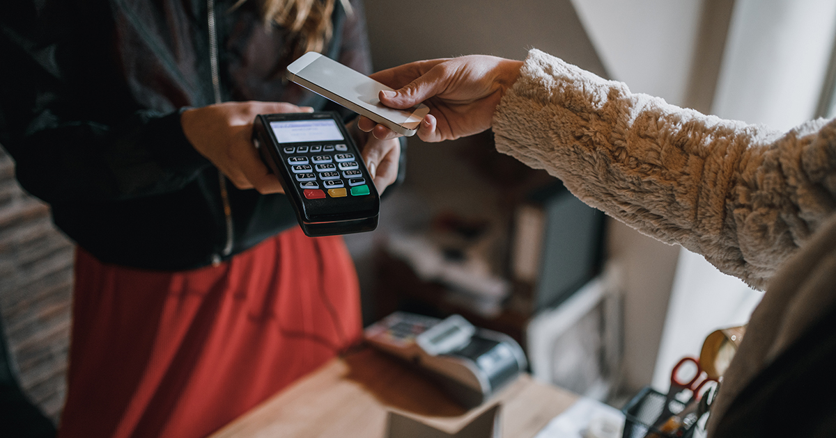 Women paying with a mobile phone