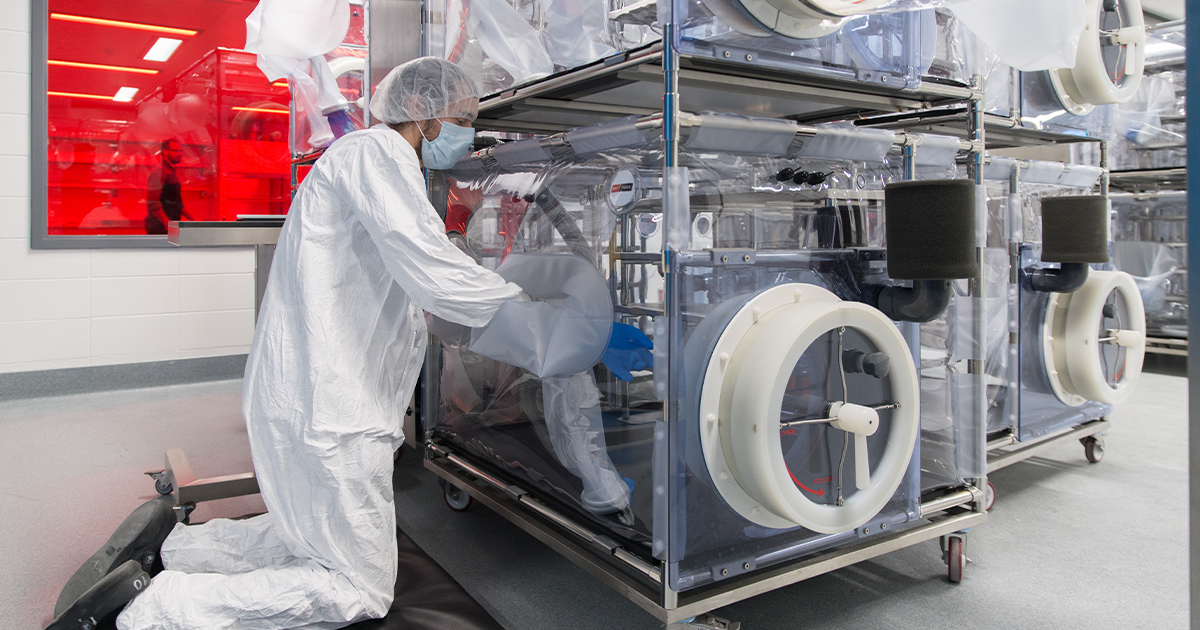 Researcher working with machine