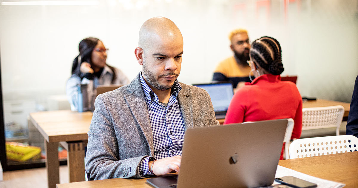 black man on computer obsidi