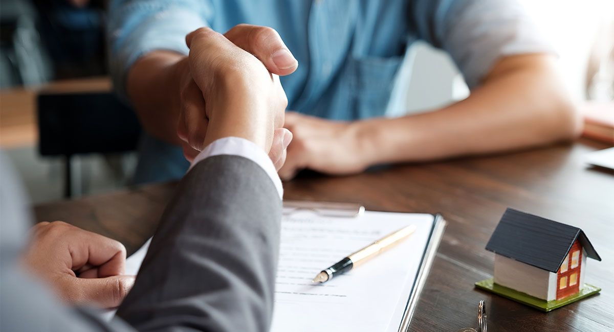 Shaking Hands With Real Estate Agent