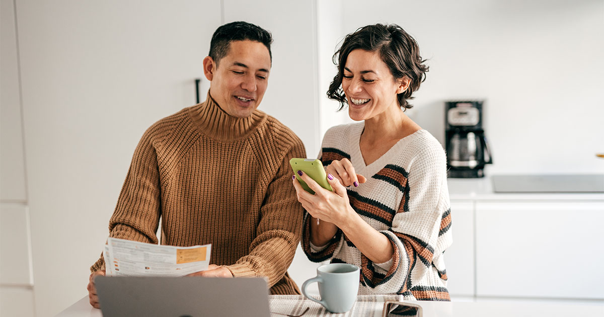 couple lookating phone mortgage