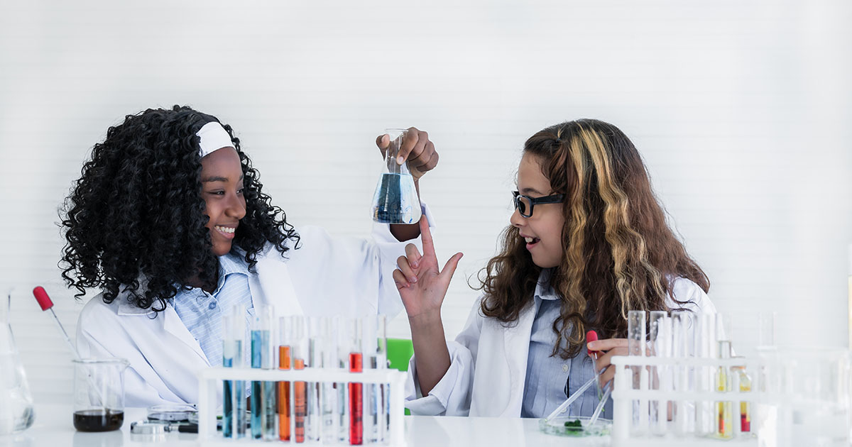 women lab coat chemicals scwist