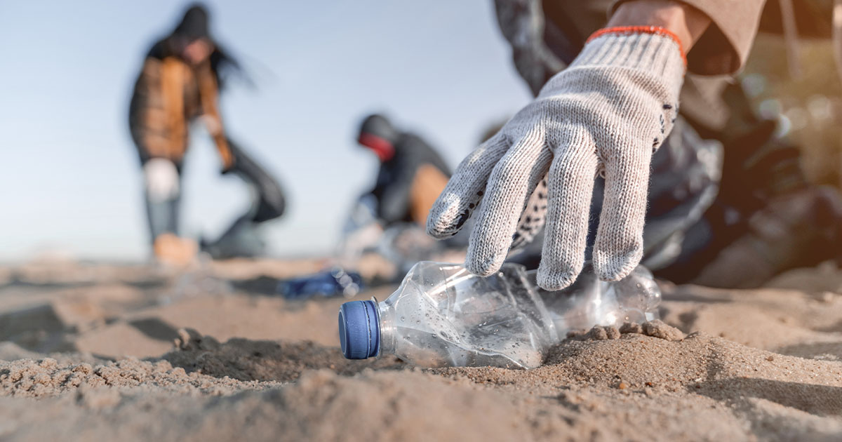 hand picking up water bottle