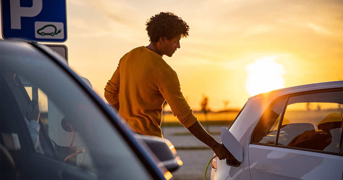 young african american man filling fuel