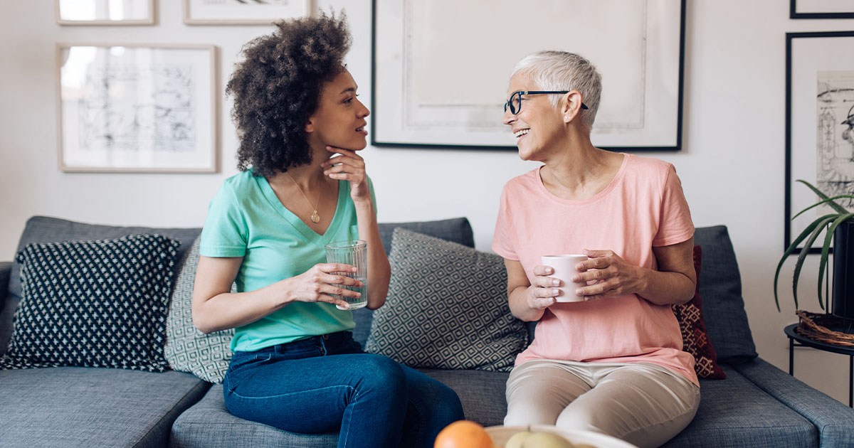 Senior woman and a younger woman talking