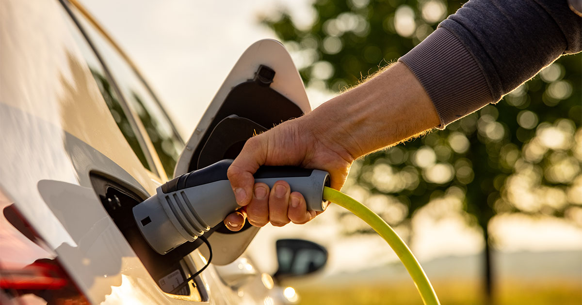 man charging vehicle