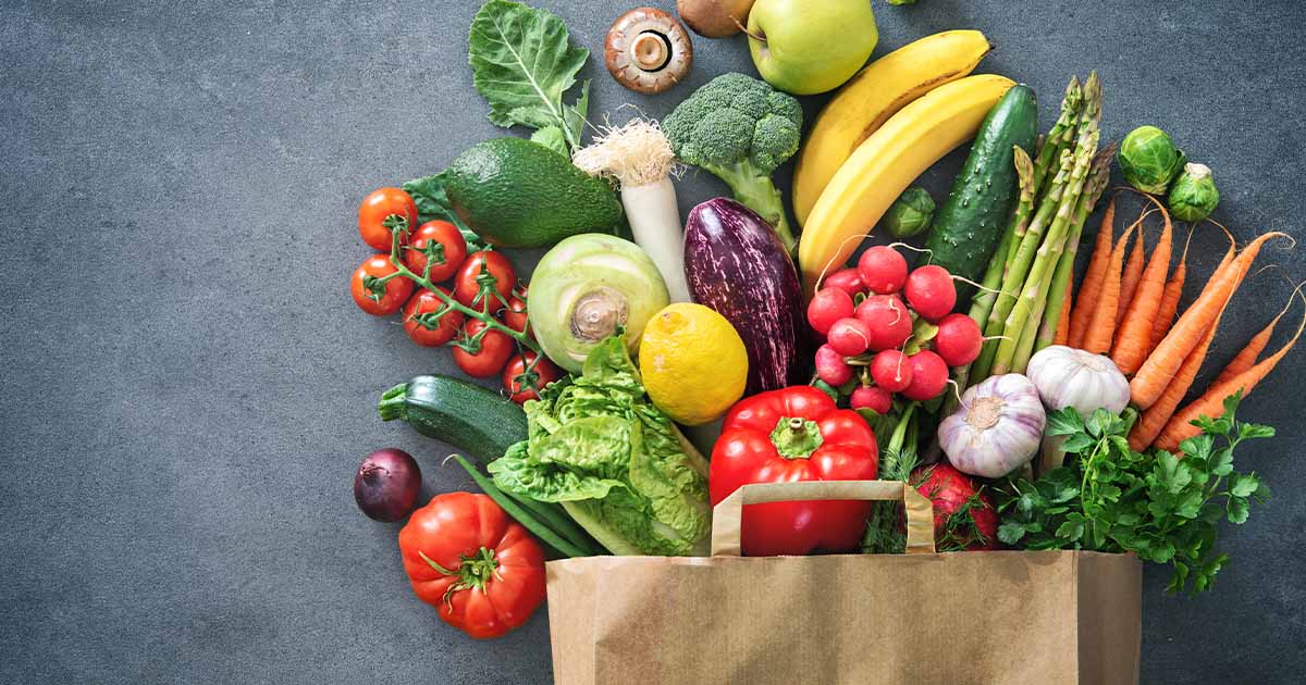 A bag full of fruits and vegetables